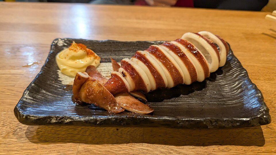 Grilled squid served at Nishiki market, Kyoto, Japan